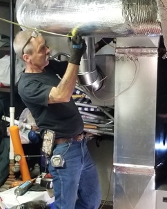 man working on ducts