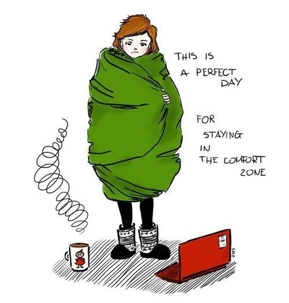 all snuggled up with blanket and computer on ground